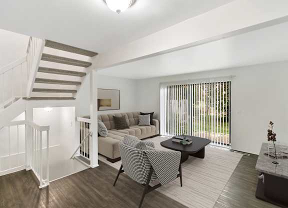Living Room With Loft View at The Village of Hyde Park, Detroit, MI