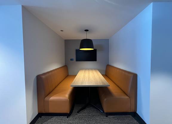 A conference room with a table and two chairs at Kingsbury Plaza, Chicago, IL, 60654