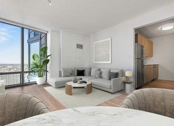 A modern living room with a large window overlooking the city.