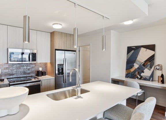 a kitchen with a white counter top and a sink at Cassidy on Canal, Chicago, IL, 60654