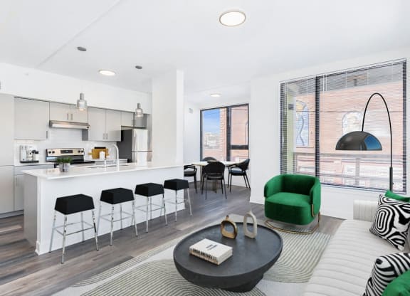 a living room with a kitchen and a dining room