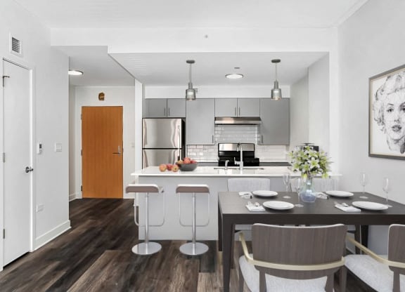 an open kitchen and dining area with a table and chairs