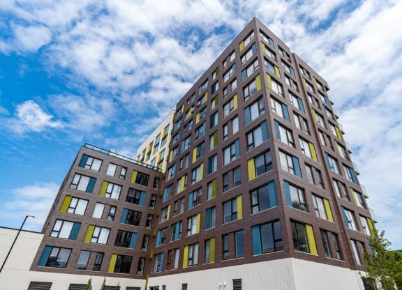 a tall building with a blue sky in the background