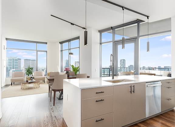 a kitchen and living room with a view of the city at Cassidy on Canal, Chicago, Illinois