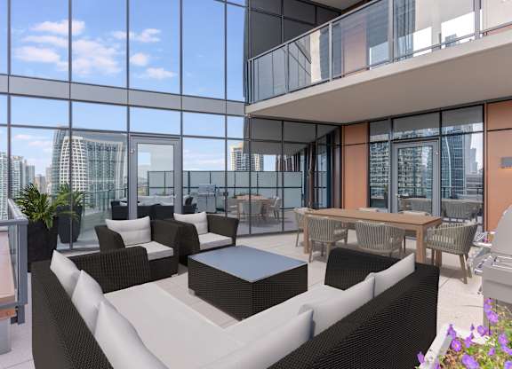 a living room with couches and a table in front of windows at Cassidy on Canal, Chicago, 60606