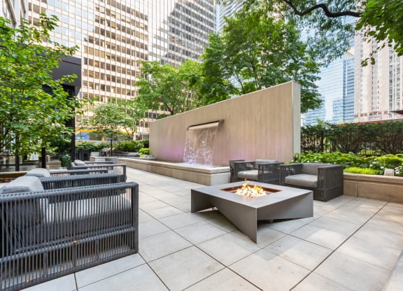 Firepit and seating area on patio at Columbus Plaza, Chicago, Illinois