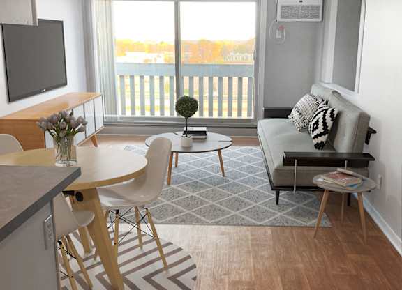 Open concept living dining area with modern furniture at Cedarvale Highlands Apartments, Eagan, MN
