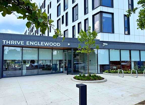 The Thrive Englewood building has a modern design with a glass facade.