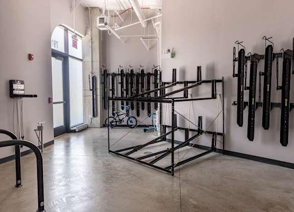 Bike storage room with wall mounted racks at Thrive Exchange Apartments, Illinois