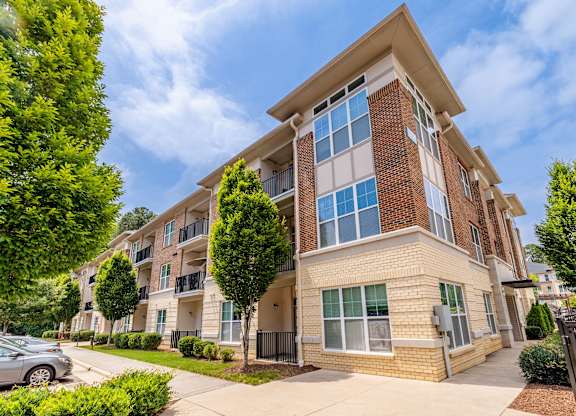 A modern apartment building with a mix of brick and siding exterior at 1701 North Apartment Homes Apartments, North Carolina, 27514