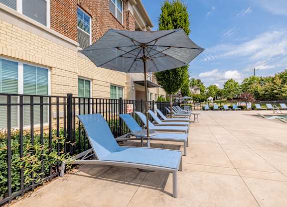 Lounge blue chairs at 1701 North Apartment Homes Apartments, Chapel Hill, NC