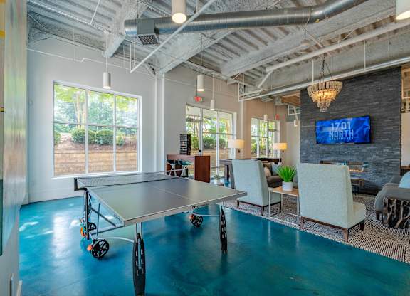 A conference room with a table and chairs at 1701 North Apartment Homes Apartments, Chapel Hill, 27514