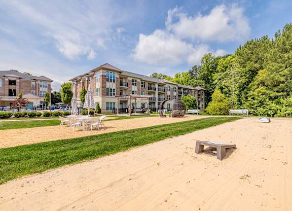 A sandy area in front of apartment buildings at 1701 North Apartment Homes Apartments, North Carolina, 27514