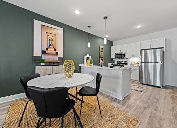 Modern kitchen with dining table at Views at Flowers, Clayton