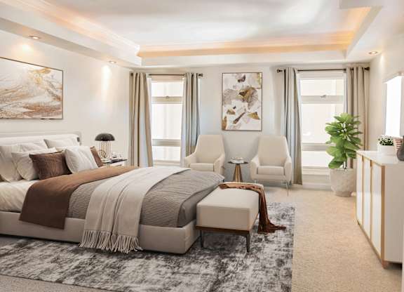 A bedroom with a large bed and a chair.