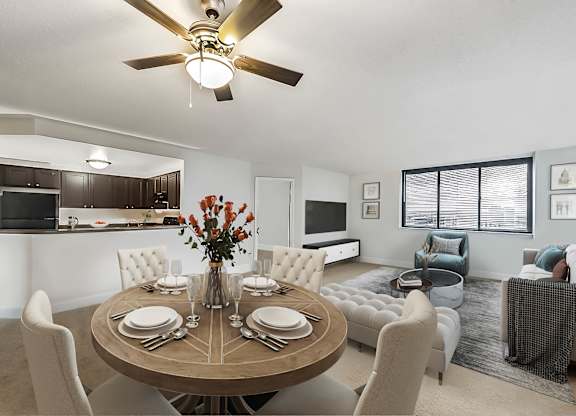A modern dining room with a round table set for six.
