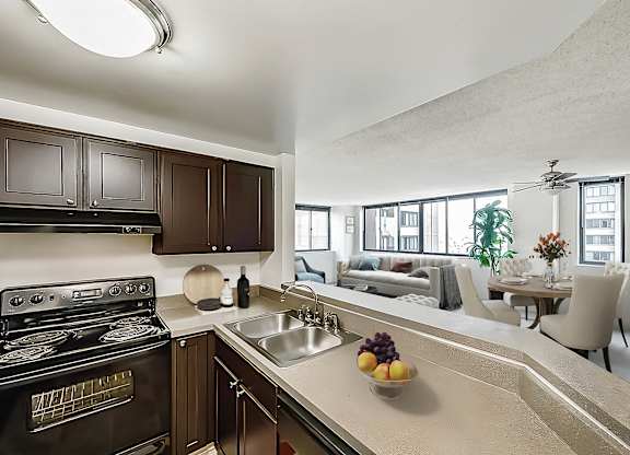A modern kitchen counter looking into living room