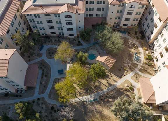 A bird's eye view of a courtyard surrounded by buildings.