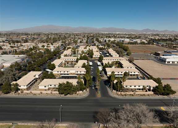 A view of a residential area with houses and a road.