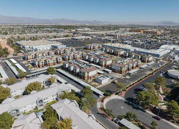 A bird's eye view of a residential area with houses and roads.