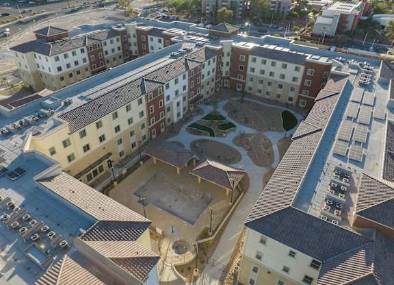 A large courtyard surrounded by buildings.