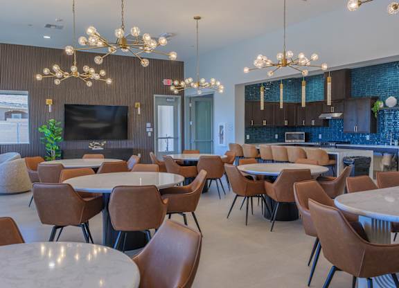 A modern dining area with brown chairs and a white table.