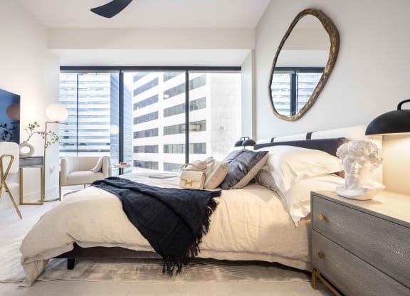 a bedroom with a large bed and a large window at 220 Meridian, Indianapolis, IN 46204
