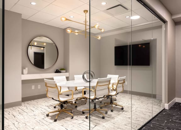 a meeting room with a table and chairs at 220 Meridian, Indianapolis, IN 46204