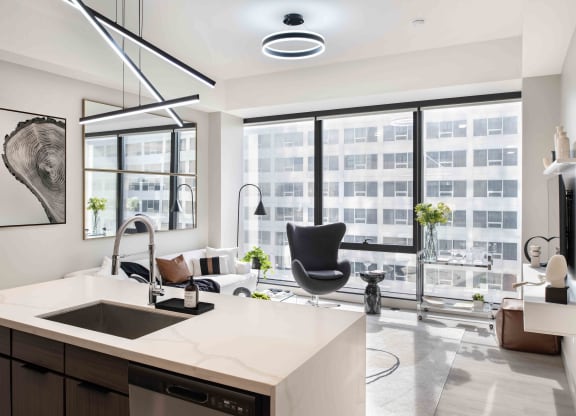 a kitchen and living room with a large window at 220 Meridian, Indianapolis, IN 46204