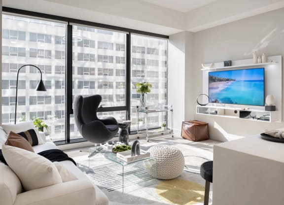 a living room filled with furniture and a large window at 220 Meridian, Indianapolis, IN 46204