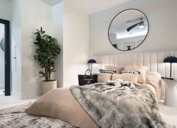 a bedroom with a bed and a mirror  at 220 Meridian, Indianapolis, IN 46204