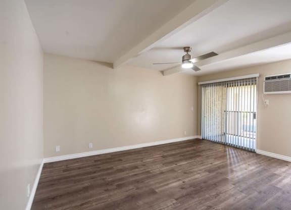 an empty room with a ceiling fan and a window at Mountainview Venture, Covina