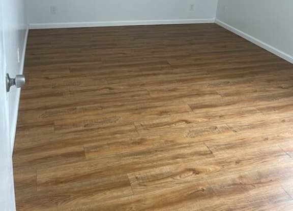 an empty room with a hardwood floor at Fiesta Apts, California, 93436