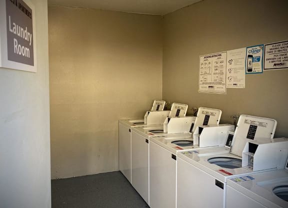 a row of washing machines sitting next to each other at Fiesta Apts, Lompoc