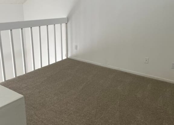 an empty bedroom with white walls and carpet at Fiesta Apts, Lompoc, 93436
