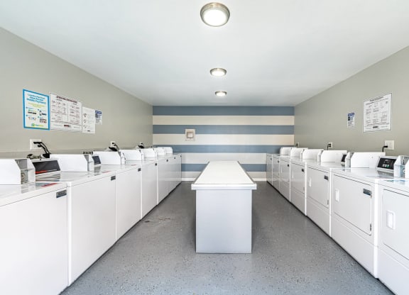 the laundry room is equipped with washers and dryers at Colima Terrace Apts, Rowland Heights, CA