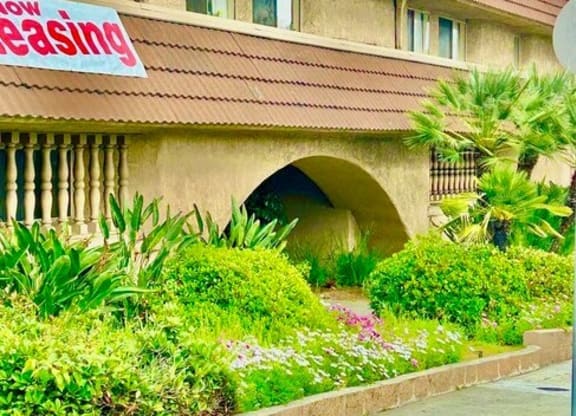 a building with a sign on the side of it at North View Terrace, Montebello, 90640