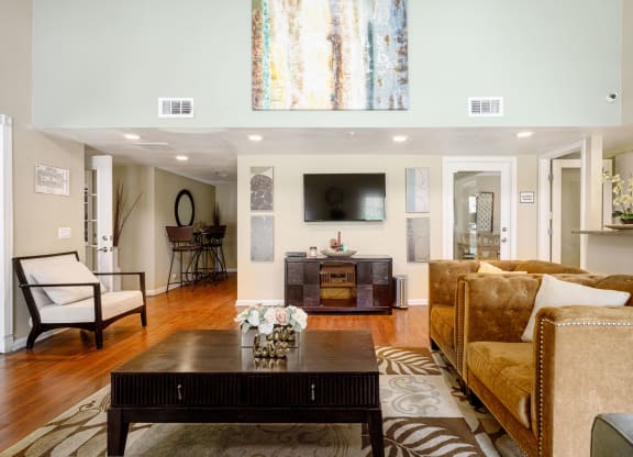 a living room filled with furniture and a flat screen tv at Sagewood Gardens Senior Apartments, Hacienda Heights
