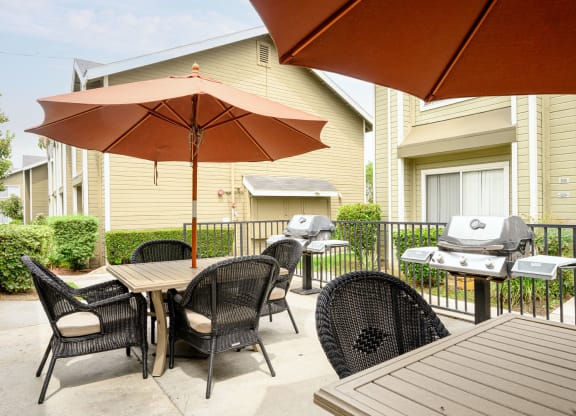 the reserve at bucklin hill patio with tables and chairs and a grill at Sagewood Gardens Senior Apartments, Hacienda Heights, CA
