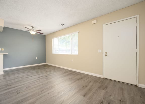 a bedroom with hardwood floors and a ceiling fan at Sagewood Gardens Senior Apartments, Hacienda Heights, CA
