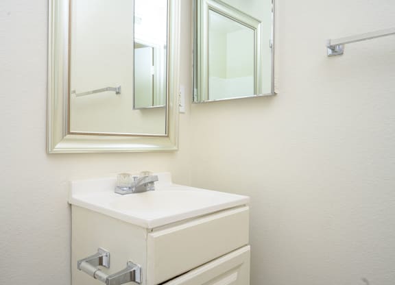 a bathroom with a sink and a mirror  at Villa Hemet, Hemet, CA 92543