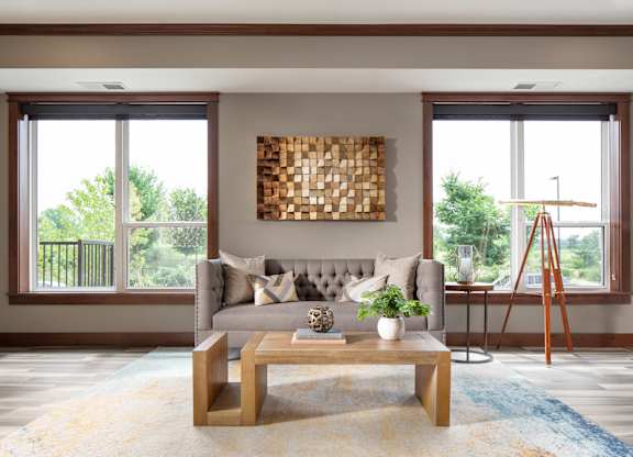 a common area with a sofa and coffee table  at Victoria Park and V2 Apartments, St. Paul, Minnesota