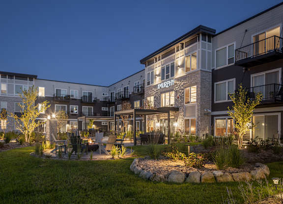 Apartment complex named Murphy with a garden in front.