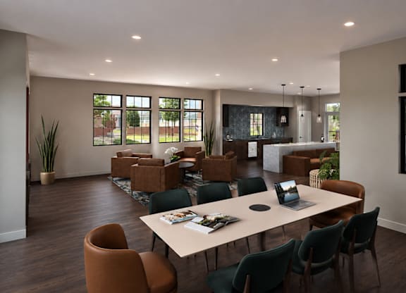 A conference room with a long table surrounded by chairs.