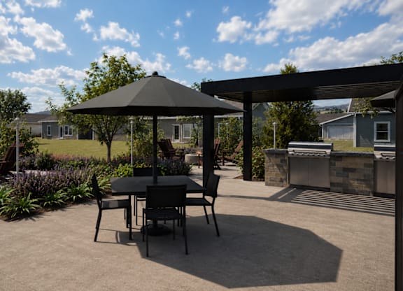 A patio with a table and chairs under a gazebo.