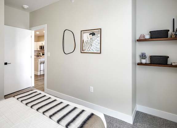 Brand new modern studio, one and two-bedroom apartment homes featuring stainless steel appliances, tile backsplash, quartz countertops, LVP flooring, large picture windows, in-unit washer and dryer and balconies at The Artisan at 39th in Omaha, NE