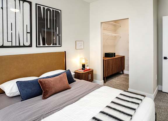 Brand new modern studio, one and two-bedroom apartment homes featuring stainless steel appliances, tile backsplash, quartz countertops, LVP flooring, large picture windows, in-unit washer and dryer and balconies at The Artisan at 39th in Omaha, NE