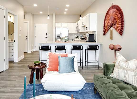 Brand new modern studio, one and two-bedroom apartment homes featuring stainless steel appliances, tile backsplash, quartz countertops, LVP flooring, large picture windows, in-unit washer and dryer and balconies at The Artisan at 39th in Omaha, NE