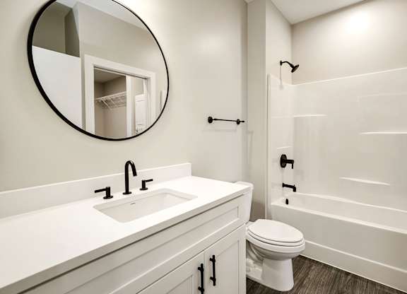 Brand new modern studio, one and two-bedroom apartment homes featuring stainless steel appliances, tile backsplash, quartz countertops, LVP flooring, large picture windows, in-unit washer and dryer and balconies at The Artisan at 39th in Omaha, NE