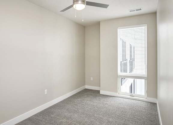 Brand new modern studio, one and two-bedroom apartment homes featuring stainless steel appliances, tile backsplash, quartz countertops, LVP flooring, large picture windows, in-unit washer and dryer and balconies at The Artisan at 39th in Omaha, NE